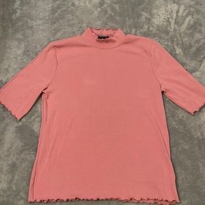 Pink mock neck with ruffled hems
